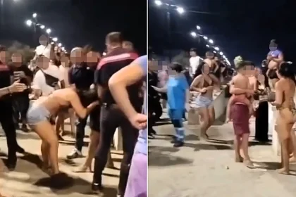 A violent beach brawl involving flying chairs, wooden crates and reportedly knives erupted during one of Italy's biggest summer celebrations - with five detained.
