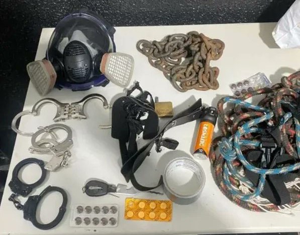 A young woman has been rescued after allegedly being chained to a bed and gagged for four days by her ex-husband - with police finding her struggling to breathe.