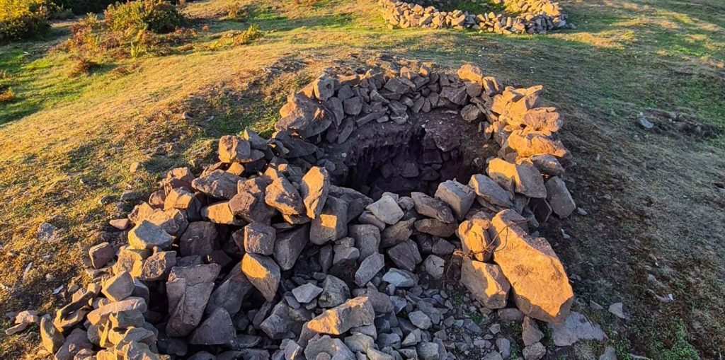 A 4,000-year-old Bronze Age burial mound has been vandalised after rocks were removed from the protected site - just two years after it was last repaired.