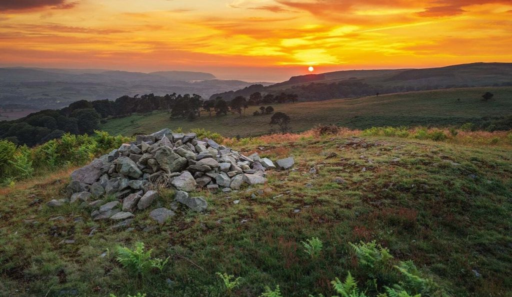 A 4,000-year-old Bronze Age burial mound has been vandalised after rocks were removed from the protected site - just two years after it was last repaired.