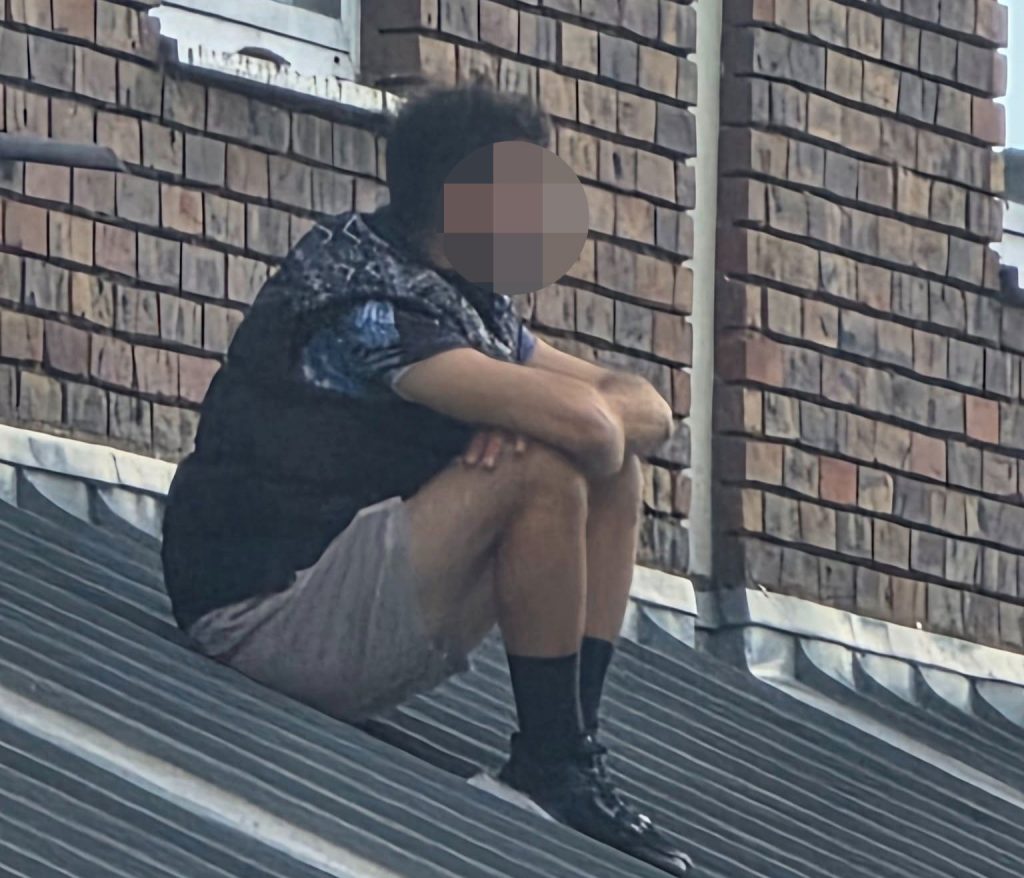 A man has been arrested after refusing to leave a building near Dover's Charlton Centre following a small fire, sparking road closures and gridlock across the town.