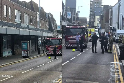 A man has been arrested after refusing to leave a building near Dover's Charlton Centre following a small fire, sparking road closures and gridlock across the town.