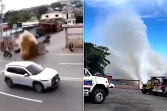A biker had a lucky escape after a 40-inch pipe burst beneath a road - ripping up the tarmac and sending water shooting into the air just seconds after he passed.
