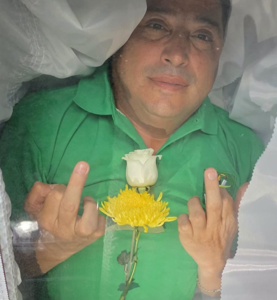 A politician was carried into a park inside a wooden coffin before sitting up and dancing in front of a cheering crowd — all part of an "aura farming" contest to boost his mayoral hopes.