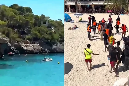 A migrant boat carrying 26 people landed on a packed Mallorca tourist beach in broad daylight - one of four to reach the islands within hours.