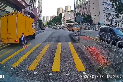 Dashcam footage shows the terrifying moment a nine-year-old boy sprints across five lanes of traffic in Hong Kong on a red signal before being hit by a huge truck.