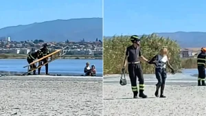 Two tourists chasing flamingo photos ignored danger signs and sank waist-deep in quicksand-like sludge at a protected Sardinian park - and now face hefty fines.