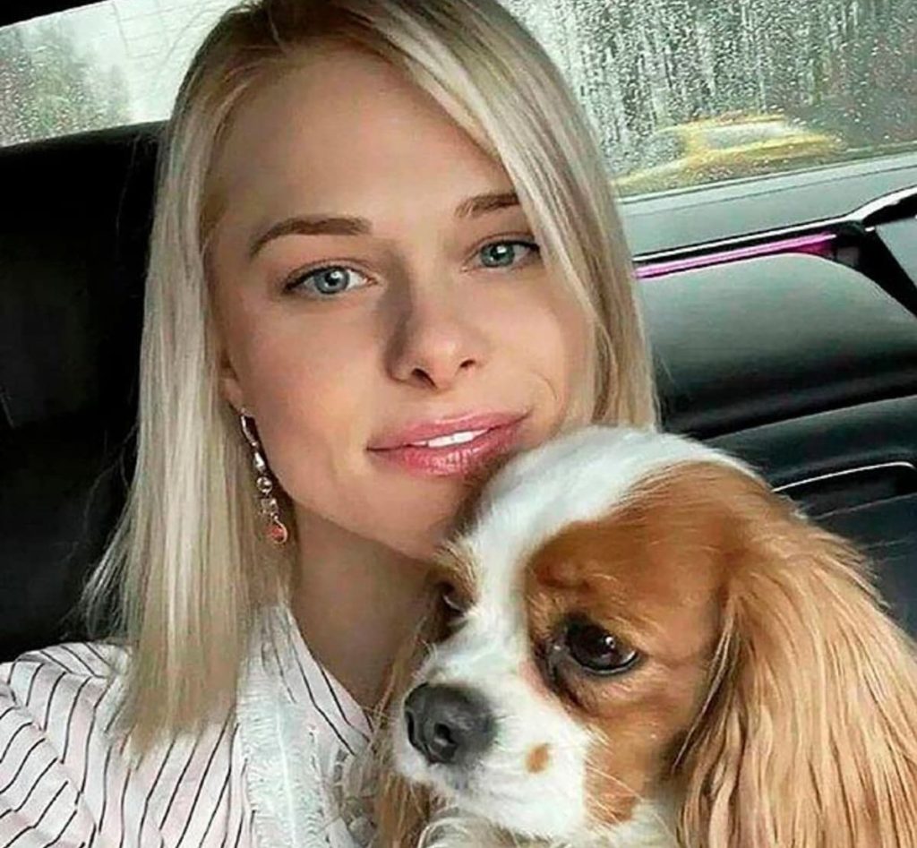 A businessman has been arrested over the killing of a beauty queen whose body was found in a forest - after her loyal pet dog led police to the spot.