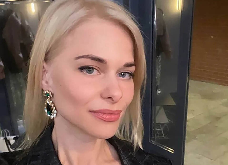A businessman has been arrested over the killing of a beauty queen whose body was found in a forest - after her loyal pet dog led police to the spot.
