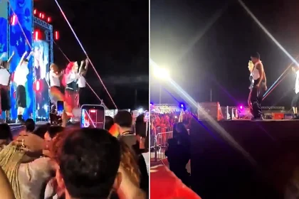 A pair of dancers were swallowed up by the ground after part of a stage collapsed mid-concert - with the singer carrying on seemingly unaware of the drama.