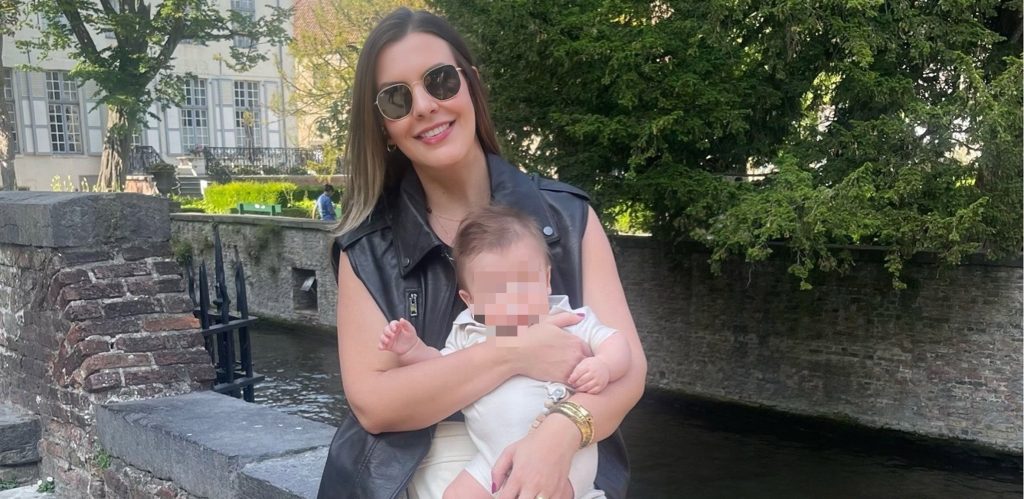 A doctor was found stabbed to death in her flat beside her eight-month-old son - after neighbours raised the alarm when they heard the baby crying for hours.