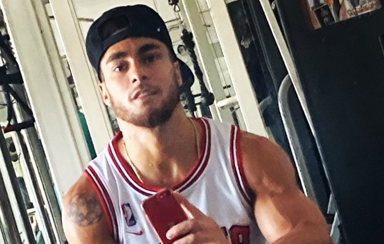 A footballer has been arrested after allegedly wrestling a police officer's gun away from her in the street - before the former River Plate star ran off with it.