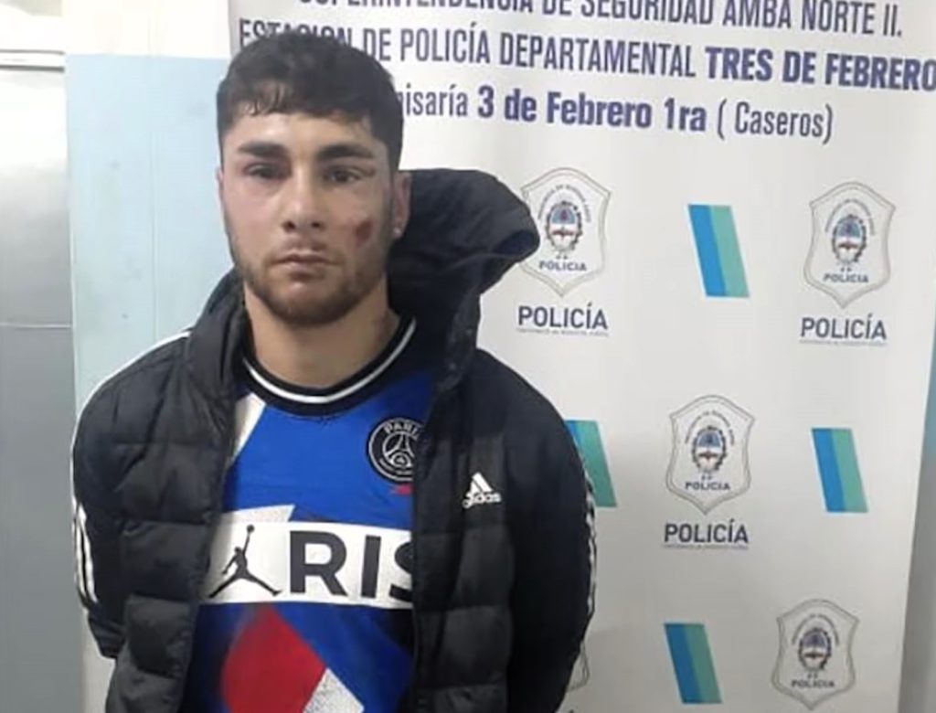 A footballer has been arrested after allegedly wrestling a police officer's gun away from her in the street - before the former River Plate star ran off with it.