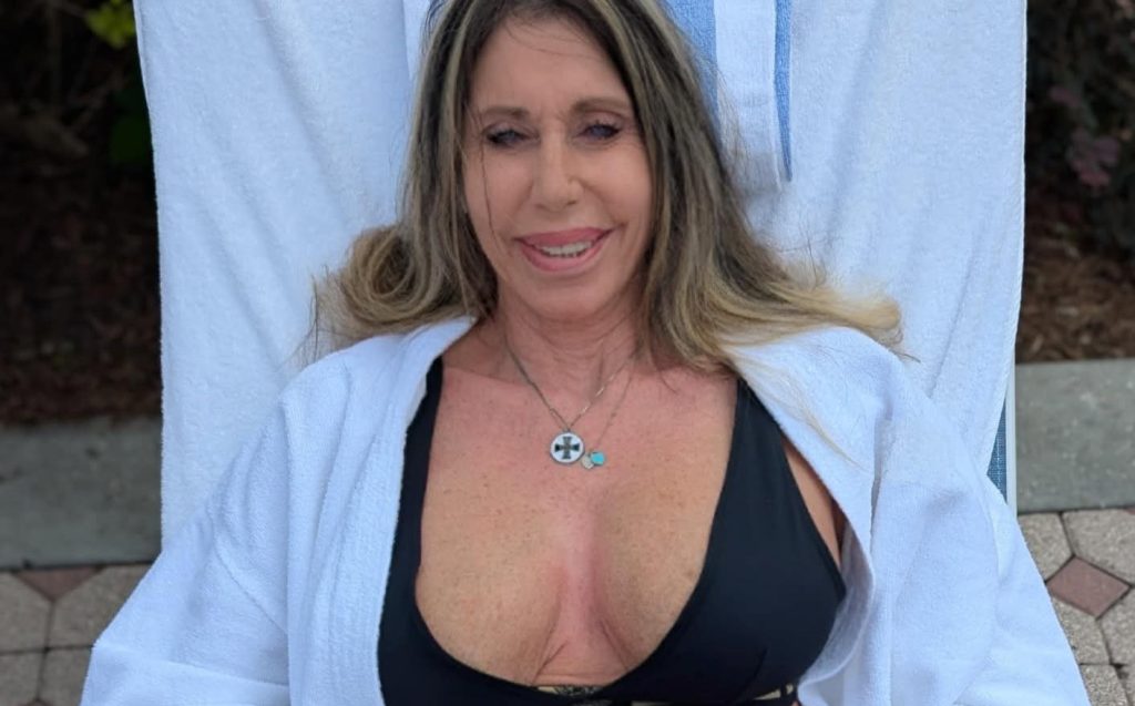 An ex-WWE legend is auctioning off one of her old breast implants for £1,000 - telling fans it is their chance to "hold" her, complete with a certificate.