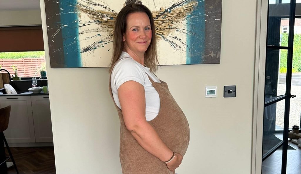 A mum given a 30% survival chance who lost her breasts to cancer says 20 strangers stepped in to feed her miracle IVF baby - her freezer is now overflowing.