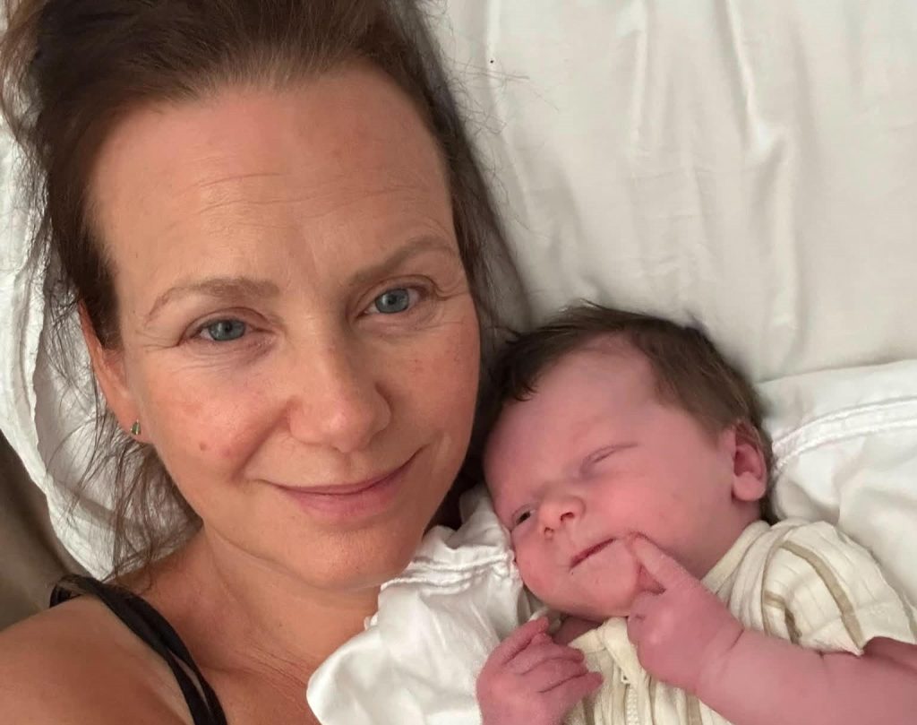 A mum given a 30% survival chance who lost her breasts to cancer says 20 strangers stepped in to feed her miracle IVF baby - her freezer is now overflowing.