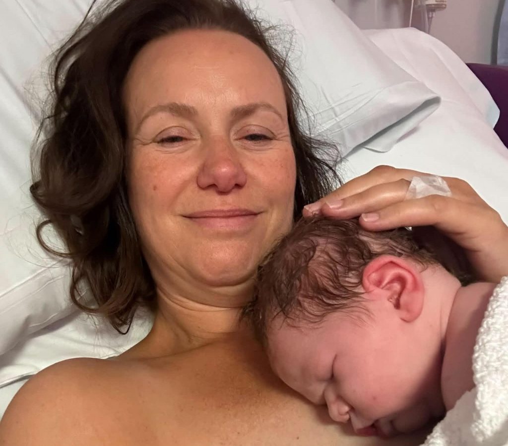 A mum given a 30% survival chance who lost her breasts to cancer says 20 strangers stepped in to feed her miracle IVF baby - her freezer is now overflowing.