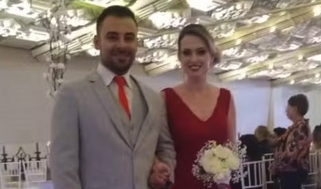 A man has been jailed for more than 13 years after stabbing his wife to death in front of their children during a row over rival football teams.