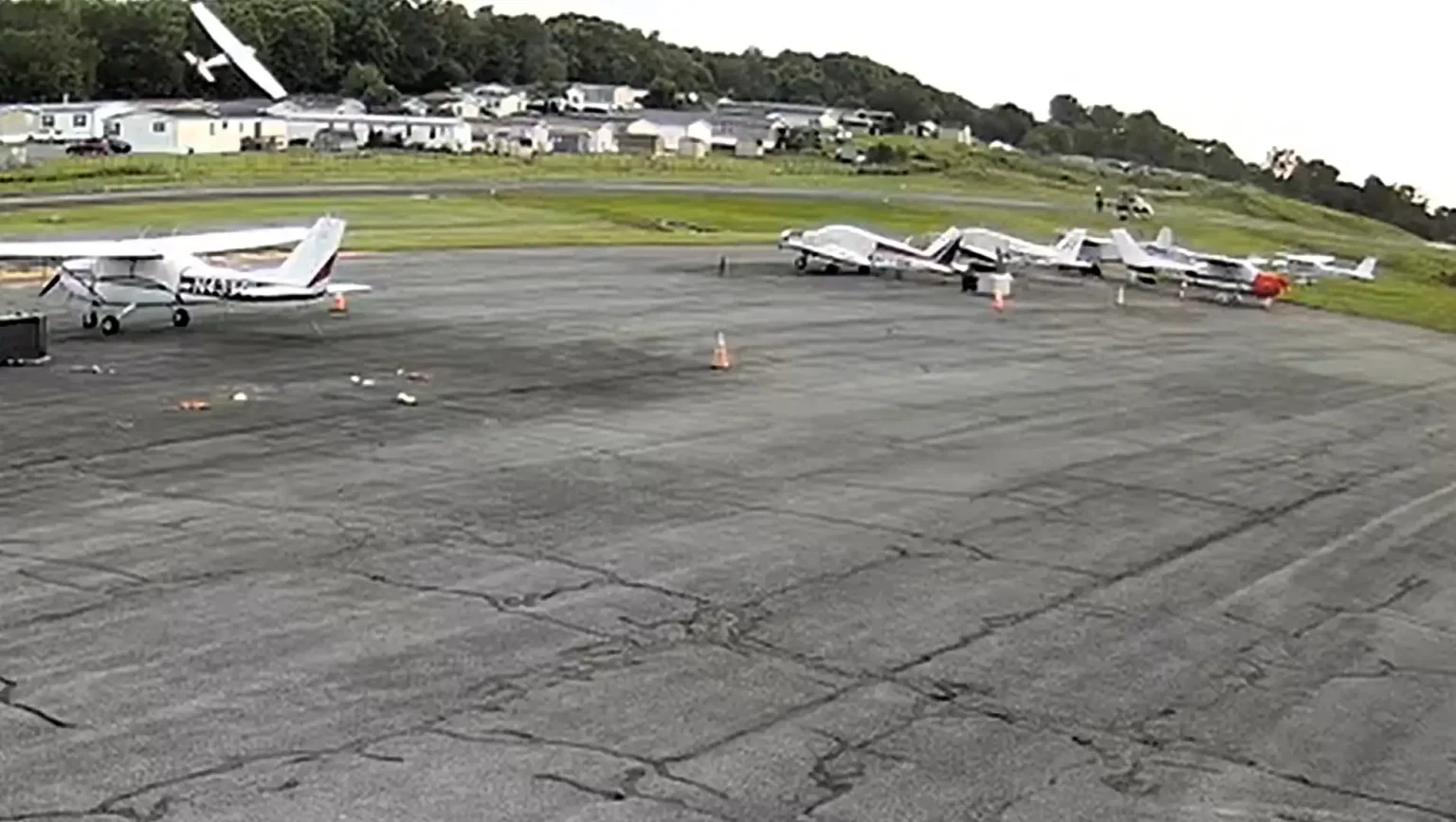 Shocking new footage shows the moments before a small plane smashed into a police helicopter - the crash killed the pilot and left two troopers seriously injured.