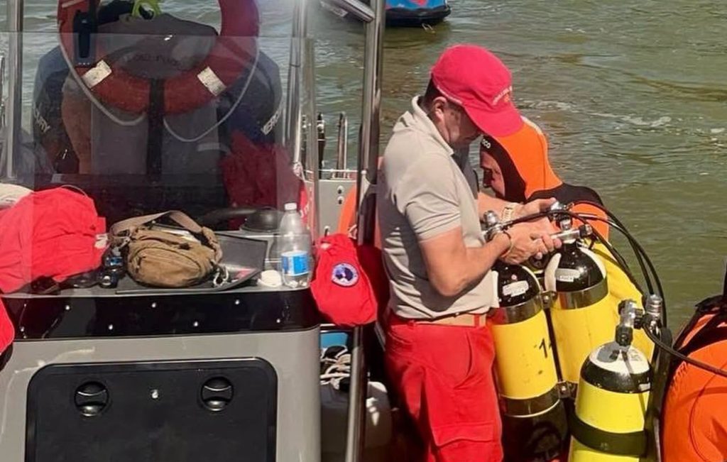 A newlywed husband has been declared brain dead and his wife is missing after their boat collided with a five-tonne water taxi - just months after their wedding.