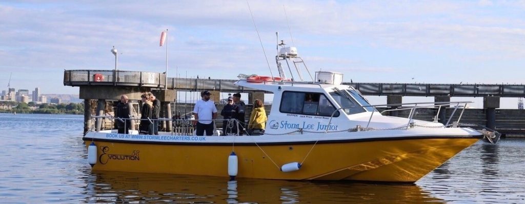 A fishing passenger was dramatically winched from a charter boat by helicopter after suffering a suspected heart attack at sea off Weston-super-Mare - and is recovering.