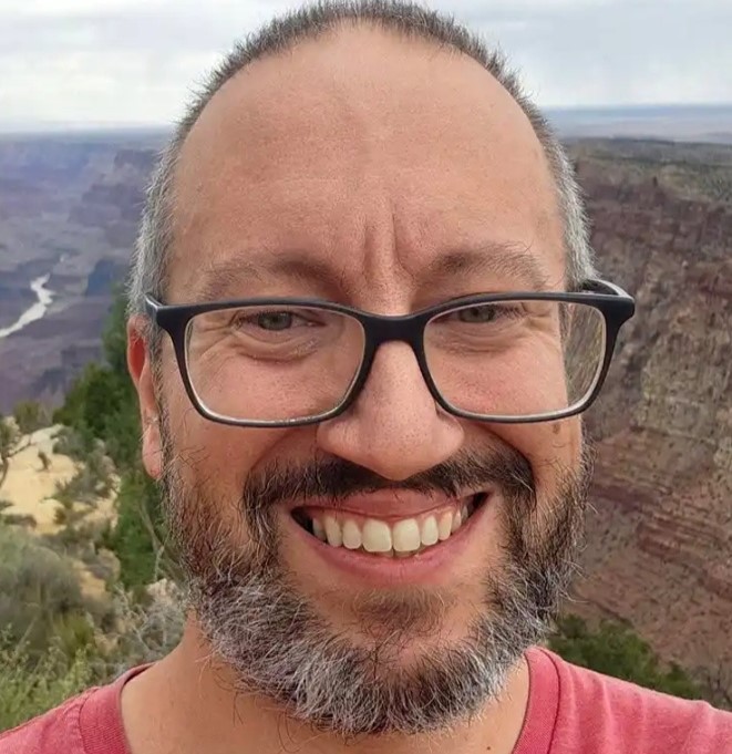 A pilot and father-of-three who vanished in a catastrophic Grand Canyon flash flood has been found dead almost three weeks on, 10 miles downstream.