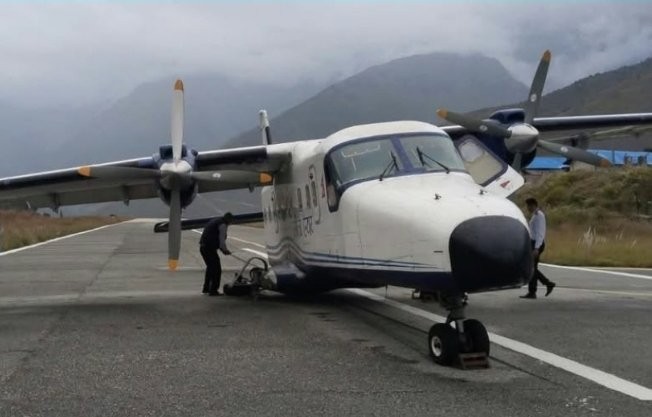 A Sita Air plane lost its rear wheel as it landed at Nepal's remote Juphal Airport, leaving it stranded on the runway - but all 16 people on board escaped unharmed.