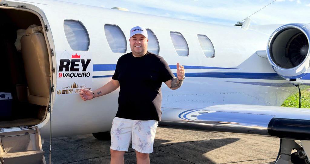 A private jet carrying a singer and seven others burst into flames after running off the runway - with all on board escaping before the aircraft was destroyed.
