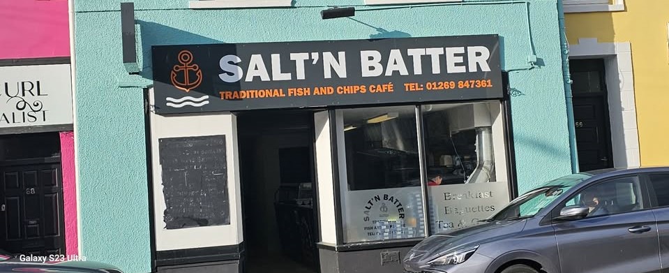 This is the brazen moment a thief swipes a fish and chip shop's tip jar while oblivious staff work just inches away - after staff had glued it to the counter.