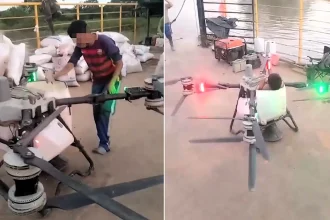 A teenager was filmed being flown metres into the air inside an agricultural spraying drone with no helmet or harness - sitting inches from the spinning propellers.
