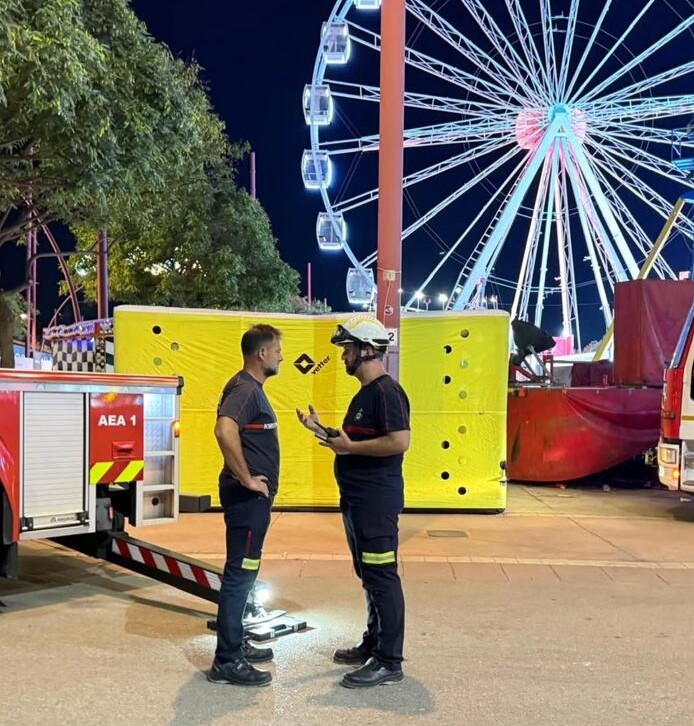 Seven thrill-seekers were left dangling almost 100ft in the air for nearly four hours after a fairground pendulum ride ground to a halt at a packed Spanish fair.