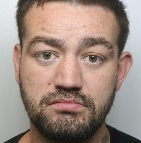 A knife-wielding thug who was caught on doorbell camera threatening to stab an elderly woman and spitting in her face has been jailed for three-and-a-half years.