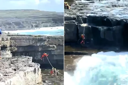 A tourist was rescued after being knocked off a cliff into Ireland's notorious Wormhole blowhole on Inis Mór, with a helicopter crew battling huge waves to reach him.
