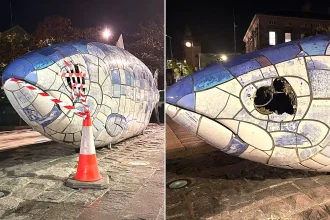 An iconic UK landmark has been left with a gaping hole where its eye should be following an alleged sledgehammer attack - with a man charged over the damage.