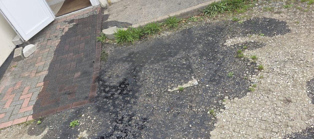 A mosque has been repeatedly rammed by a car before suspected vandals poured an oily substance across its grounds - with police treating it as racially aggravated.