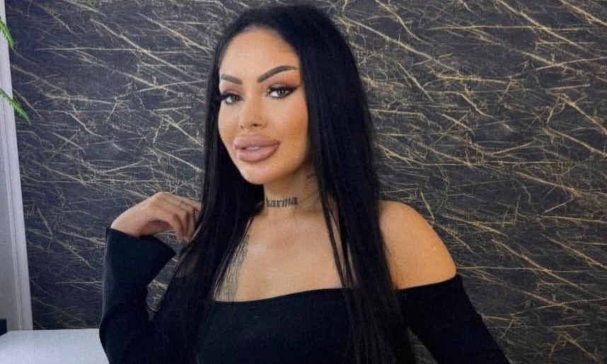 A major police investigation is underway after a 28-year-old hairstylist was found dead inside a suitcase floating in a river - with her boyfriend now on the run.