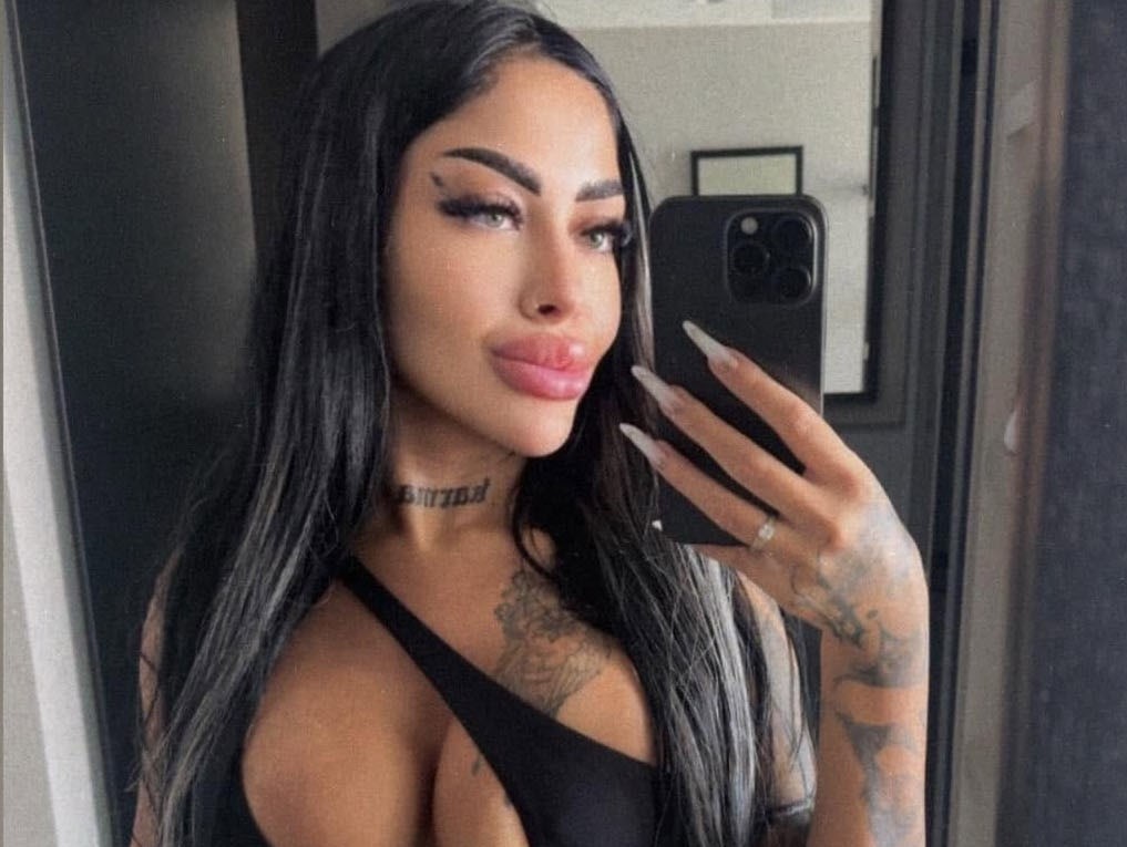 A major police investigation is underway after a 28-year-old hairstylist was found dead inside a suitcase floating in a river - with her boyfriend now on the run.