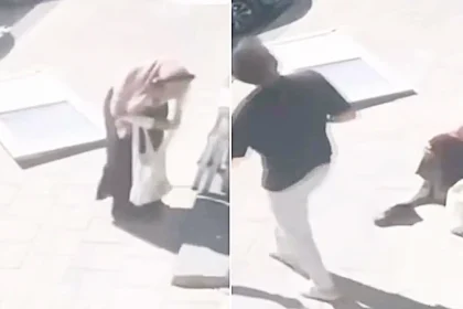Terrifying CCTV shows a door plunging 23ft from a building and smashing onto a woman's foot - it missed her head by inches and she is now suing.