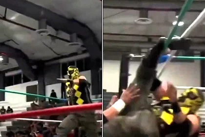A wrestler suffered a horrifying leg injury after his foot became trapped in the ropes mid-flying move - leaving him hanging helplessly above the canvas in agony.