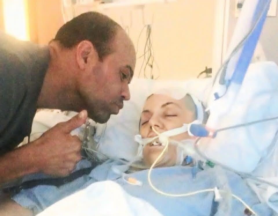 A woman who was told she would not survive a brain bleed claims she met her dead father in another realm - and came back with a message that death isn't real.