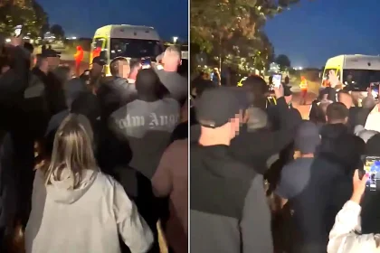 A "migrant taxi" boat carrying 26 people landed on a packed Mallorca beach in broad daylight - as lifeguards rushed to pull swimmers from the water.