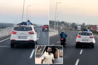 A brave cop clung to the roof of a speeding SUV for nearly 20 miles after suspected smugglers carrying 170kg of banned tobacco fled a dawn police check in southern India.