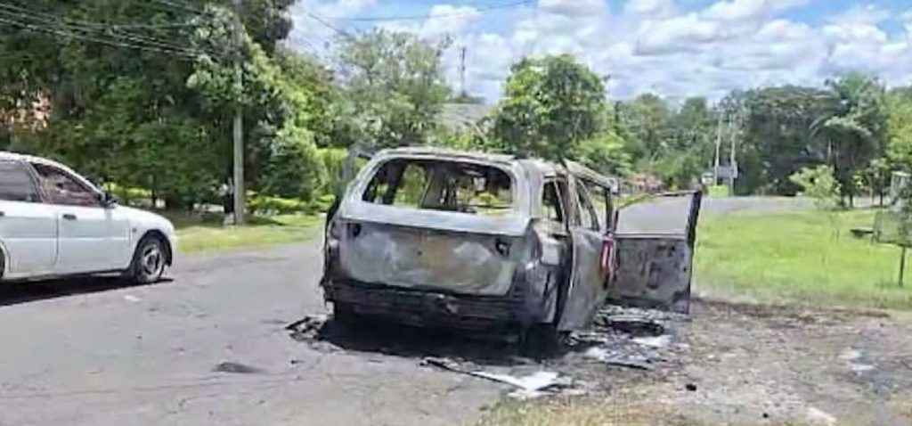 A hearse burst into flames on the way to a funeral in Panama - but the brave driver escaped and dragged the coffin clear before the fire could reach the body inside.