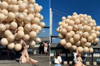 A bride nearly got carried away by a giant bunch of balloons after strong winds turned her romantic wedding photoshoot into chaos.