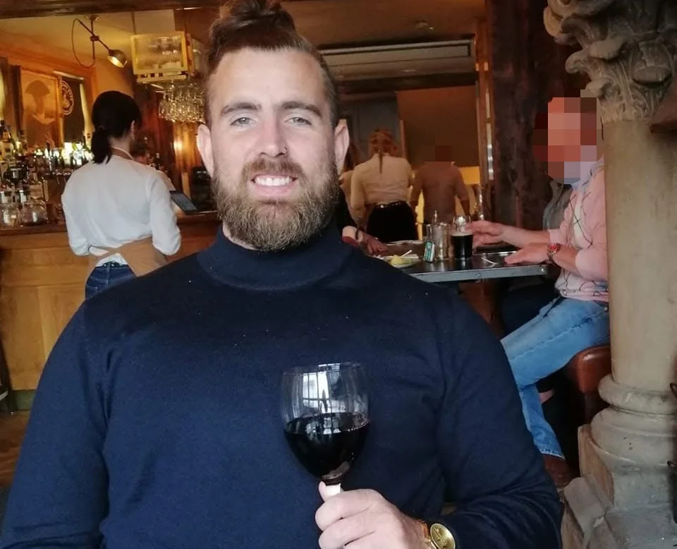 British football coach Warren Coard, 37, dies suddenly on holiday in Tenerife with friends, leaving fiancée and two young sons heartbroken and facing funeral costs.