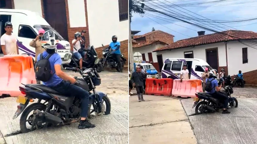 A hapless motorcyclist got himself stuck in wet concrete after ignoring road closure signs and riding straight into a freshly paved road.