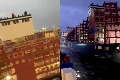 A cruise liner has crashed into container ships during a storm, tearing open a vessel’s hull and leaving passengers shaken.