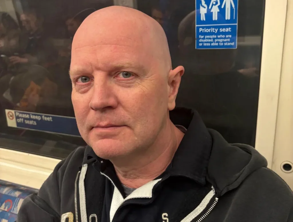 Man on underground train before his stroke.