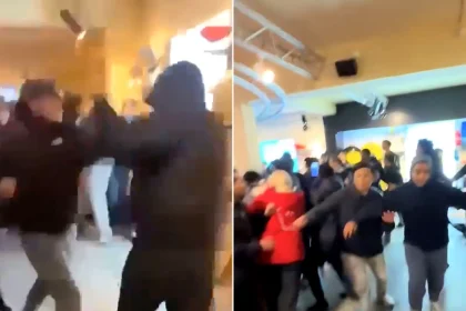 A huge brawl has erupted during a Halloween fright night at a theme park with riot police and dogs deployed to break up the fighting.