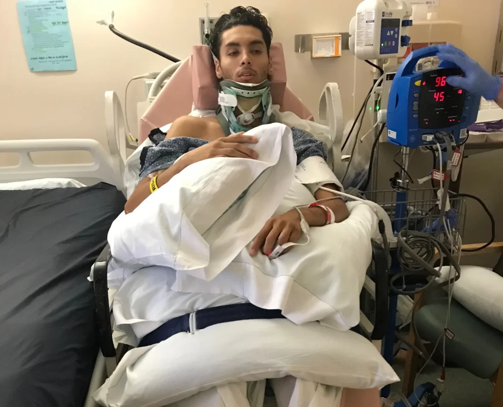 Model left paralysed from chest down after diving into mislabelled shallow pool. Now 27, Isaac Lambert has gone viral sharing his story of survival and seven surgeries.